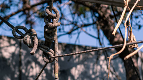 Low angle view of rope on rusty metal