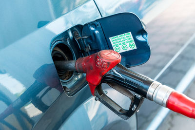 Pipe refueling car at gas station