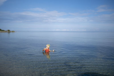 Girl swimming in sea