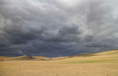 Scenic view of dramatic sky over land