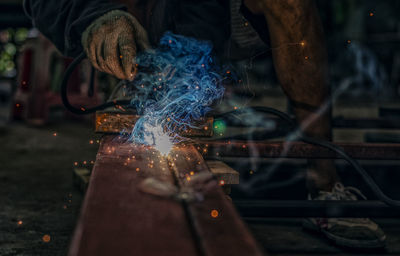 Low section of manual worker working in factory