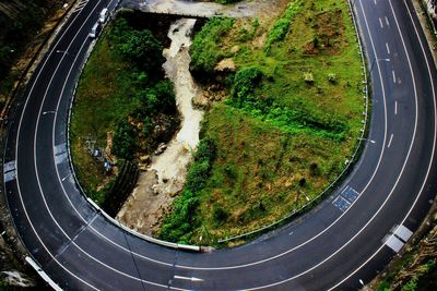 High angle shot of curved road along landscape