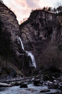 Scenic view of waterfall against sky