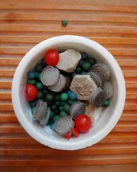 Directly above shot of candies in plate on table