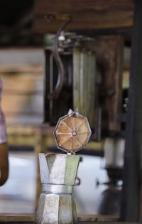 Close-up of old electric lamp on table