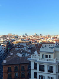 High angle view of townscape against blue sky