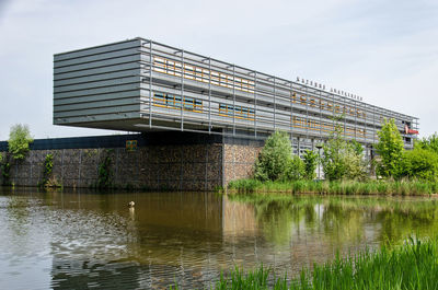 The fire brigade building cantilevering above the nearby lake