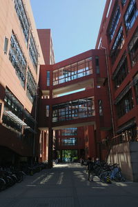 Street amidst buildings against sky in city