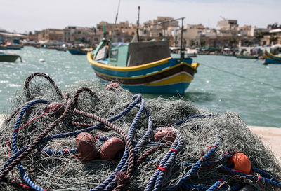 Fishing boats moored at harbor