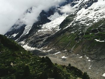 High angle view of snowcapped mountains against sky