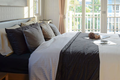 View of cat relaxing on bed at home