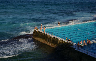 High angle view of people at infinity pool