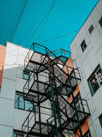 Low angle view of modern building against clear blue sky