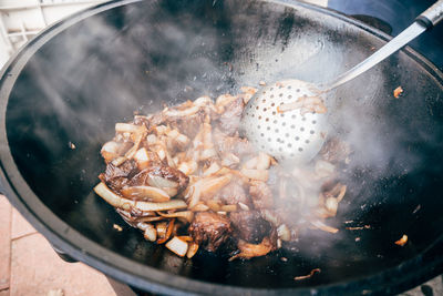 High angle view of meat in cooking pan