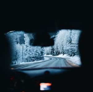 Close-up of car on road during winter