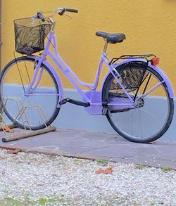 Bicycle parked against wall