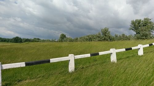 Scenic view of green landscape against sky