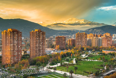 High angle view of buildings in city against sky during sunset