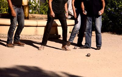 Low section of people standing on road