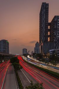 High angle view of light trails on road at sunset