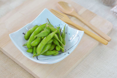 High angle view of vegetables in plate on table