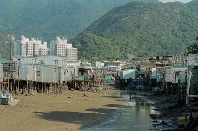 Scenic view of beach by buildings in city