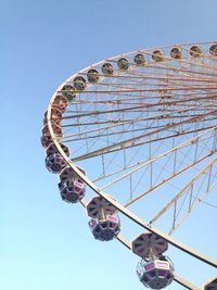 Low angle view of ferries wheel against clear sky