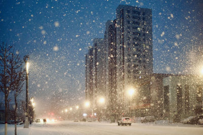 View of city street during winter at night