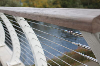 High angle view of ropes on railing