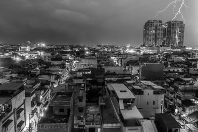 High angle view of illuminated buildings in city against sky