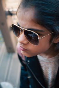 Close-up of young woman wearing sunglasses