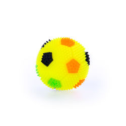 Close-up of yellow ball against white background