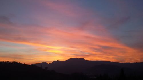 Scenic view of dramatic sky during sunset