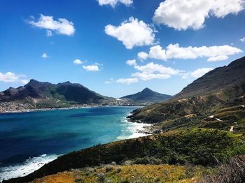 Scenic view of mountains against blue sky