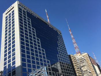 Low angle view of modern buildings against clear sky