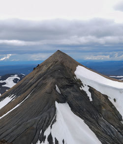 Scenic view of snow covered mountain against sky