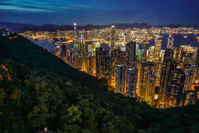 High angle view of illuminated city buildings at night