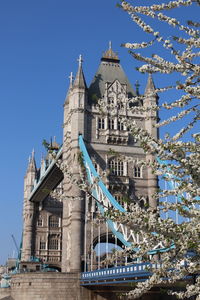 Low angle view of tower bridge against sky