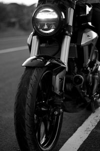 Close-up of bicycle parked on road