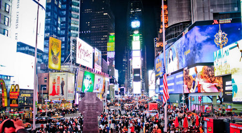 Crowd on city street at night