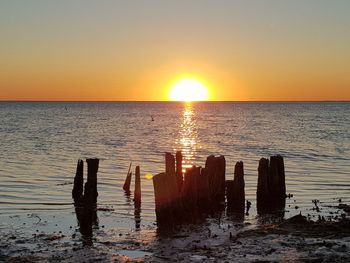 Scenic view of sea against sky during sunset