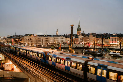 View of railroad tracks and buildings in city