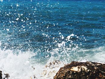 Sea waves splashing on rocks