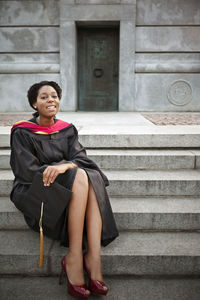 Portrait of woman wearing graduation gown