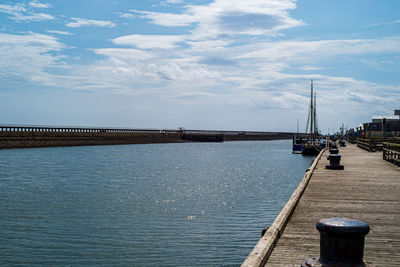 Pier over sea against sky