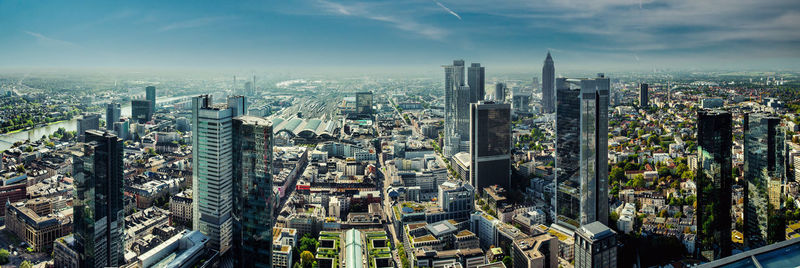 Aerial view of modern buildings in city against sky