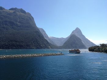 Scenic view of lake against mountain range