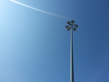 Low angle view of floodlight against clear blue sky