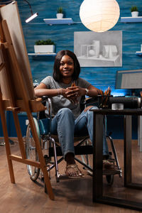 Young woman sitting on chair