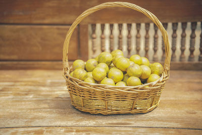 Close-up of fruits in basket on table